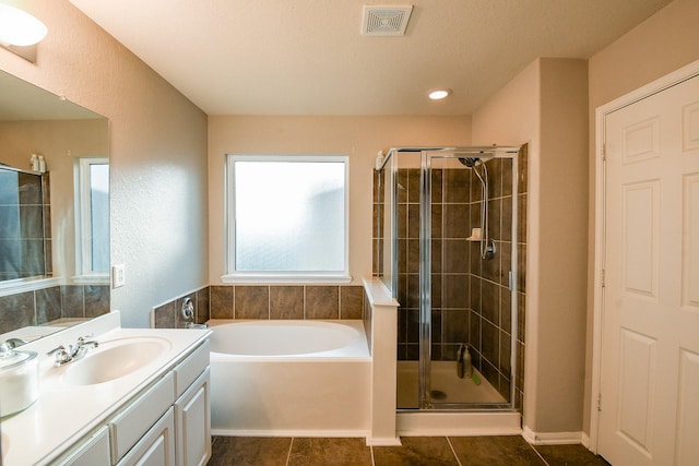 11019 Chestnut Path Way, Tomball, TX 77375 - full bath featuring a stall shower, vanity, a garden tub, and tile patterned flooring