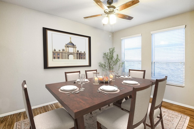 11019 Chestnut Path Way, Tomball, TX 77375 - dining area with wood finished floors, a ceiling fan, and baseboards