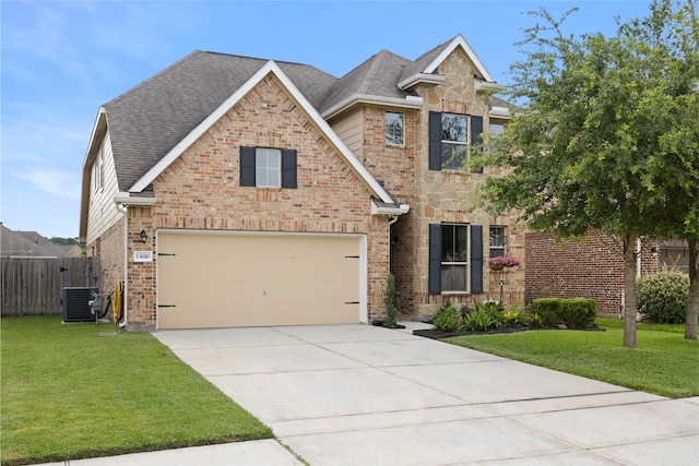 13610 Spectacled Bear Ln, Crosby, TX 77532 - view of front of property with cooling unit, driveway, a garage, and brick siding