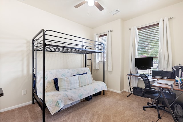 13610 Spectacled Bear Ln, Crosby, TX 77532 - carpeted bedroom featuring a desk, baseboards, and a ceiling fan