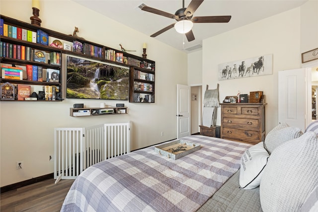 13610 Spectacled Bear Ln, Crosby, TX 77532 - bedroom with wood finished floors, baseboards, and a ceiling fan