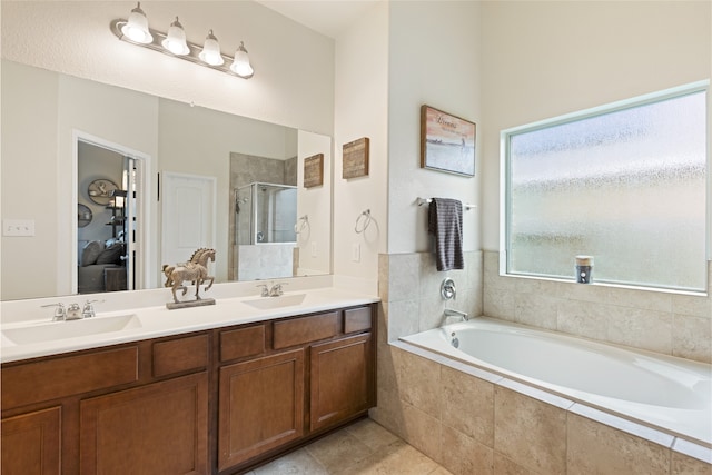 13610 Spectacled Bear Ln, Crosby, TX 77532 - bathroom featuring a shower stall, a bath, double vanity, and tile patterned flooring