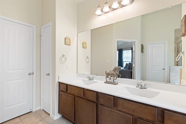 13610 Spectacled Bear Ln, Crosby, TX 77532 - ensuite bathroom featuring double vanity, tile patterned floors, and an enclosed shower