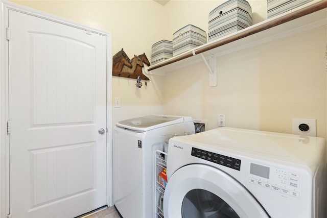 13610 Spectacled Bear Ln, Crosby, TX 77532 - washroom featuring separate washer and dryer