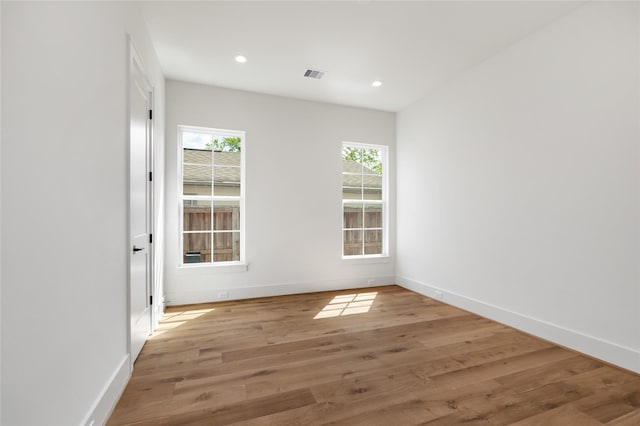 1611 Richelieu Ln, Houston, TX 77018 - empty room with healthy amount of natural light, recessed lighting, and wood finished floors