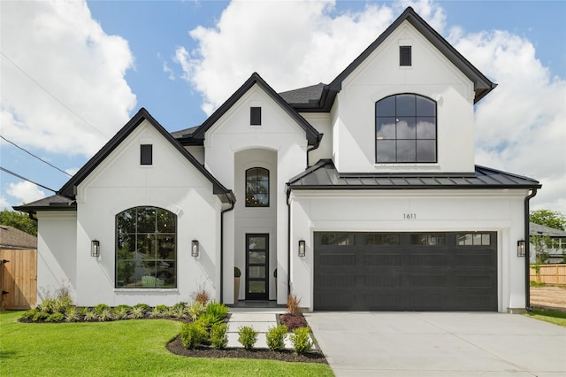 1611 Richelieu Ln, Houston, TX 77018 - french country style house featuring a standing seam roof, concrete driveway, stucco siding, a garage, and a metal roof