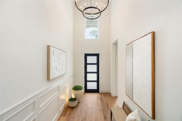 1611 Richelieu Ln, Houston, TX 77018 - entrance foyer with a chandelier, a towering ceiling, and light wood-style floors