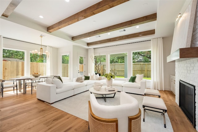 1611 Richelieu Ln, Houston, TX 77018 - living room featuring healthy amount of natural light, light wood-style flooring, beam ceiling, a chandelier, and recessed lighting