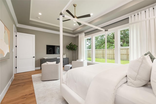 1611 Richelieu Ln, Houston, TX 77018 - bedroom with crown molding, wood finished floors, recessed lighting, a tray ceiling, and ceiling fan
