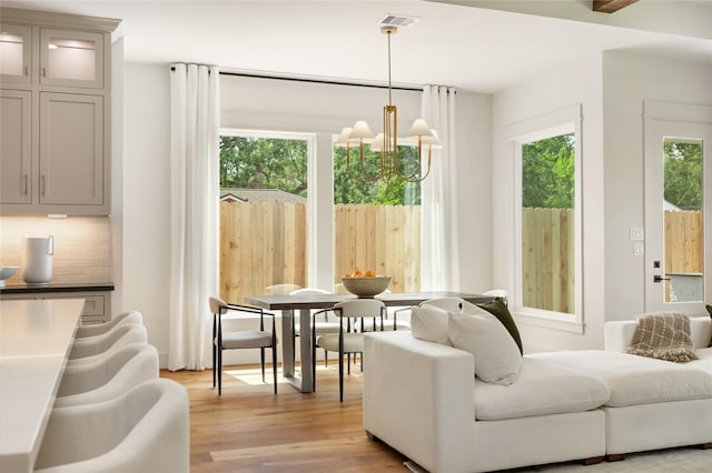 1611 Richelieu Ln, Houston, TX 77018 - living room with a chandelier and light wood-style floors