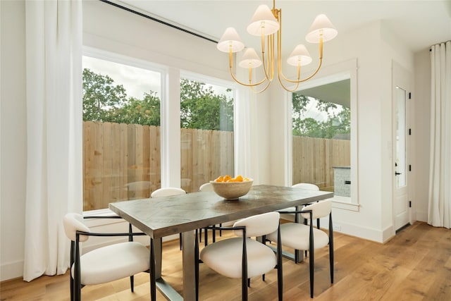 1611 Richelieu Ln, Houston, TX 77018 - dining area with a chandelier and light wood-style floors