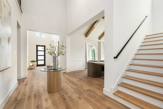 1611 Richelieu Ln, Houston, TX 77018 - foyer with stairs, a towering ceiling, light wood-style flooring, and beamed ceiling