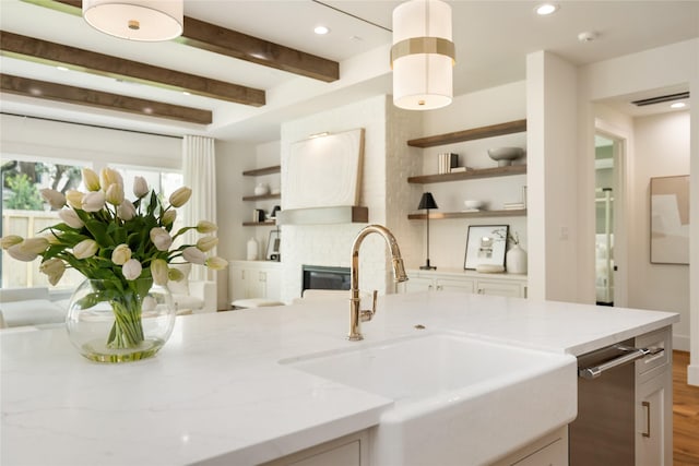 1611 Richelieu Ln, Houston, TX 77018 - kitchen featuring open shelves, light stone countertops, recessed lighting, wood finished floors, and a glass covered fireplace