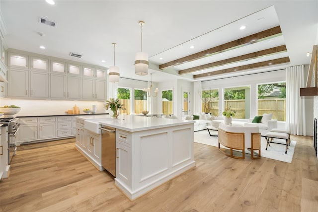 1611 Richelieu Ln, Houston, TX 77018 - kitchen with appliances with stainless steel finishes, white cabinetry, open floor plan, recessed lighting, and light wood finished floors