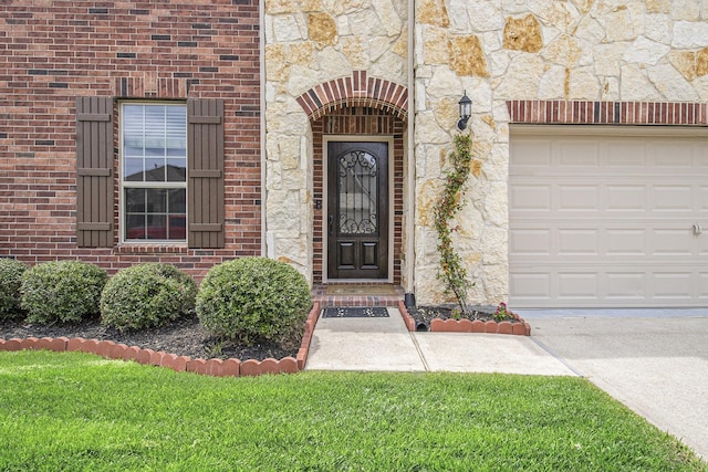 19903 Mulberry Pine Ln, Cypress, TX 77429 - view of exterior entry with stone siding and an attached garage