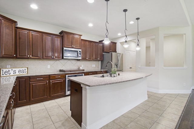 19903 Mulberry Pine Ln, Cypress, TX 77429 - kitchen with appliances with stainless steel finishes, a sink, light tile patterned floors, tasteful backsplash, and recessed lighting