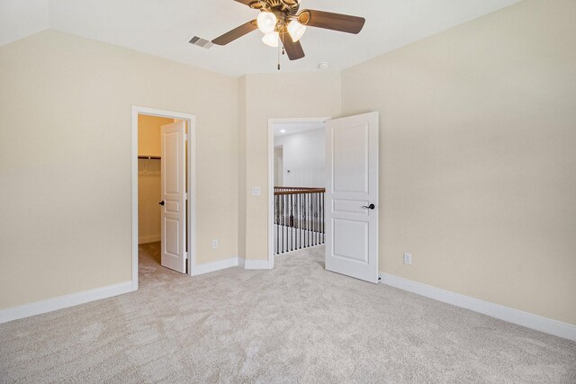 19903 Mulberry Pine Ln, Cypress, TX 77429 - unfurnished bedroom with carpet floors, a spacious closet, baseboards, and a ceiling fan