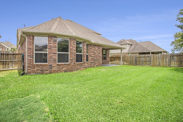 19903 Mulberry Pine Ln, Cypress, TX 77429 - rear view of property featuring brick siding and a shingled roof
