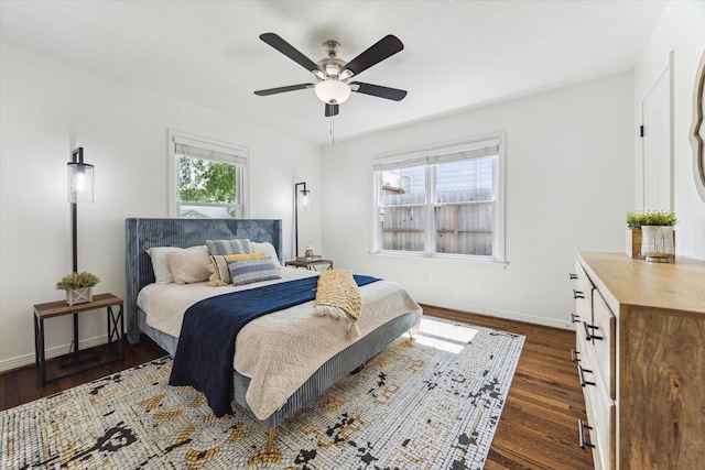1709 Chantilly Ln, Houston, TX 77018 - bedroom with dark wood-type flooring, baseboards, and a ceiling fan