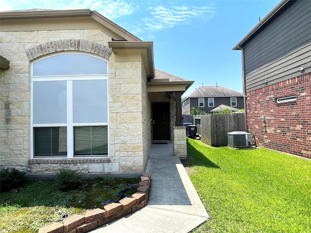 29314 Nectar Bloom Ct, Spring, TX 77386 - property entrance with stone siding and central AC