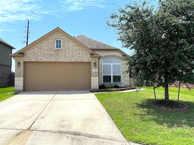 29314 Nectar Bloom Ct, Spring, TX 77386 - french provincial home featuring driveway, a garage, a front yard, and stone siding