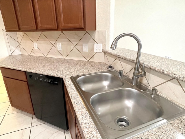 29314 Nectar Bloom Ct, Spring, TX 77386 - kitchen featuring black dishwasher, a sink, brown cabinets, backsplash, and light tile patterned floors