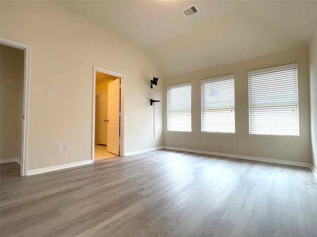 29314 Nectar Bloom Ct, Spring, TX 77386 - spare room featuring vaulted ceiling, light wood finished floors, and baseboards