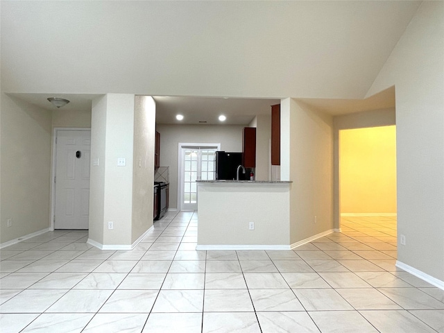 29314 Nectar Bloom Ct, Spring, TX 77386 - kitchen with freestanding refrigerator, light tile patterned floors, recessed lighting, light countertops, and a sink