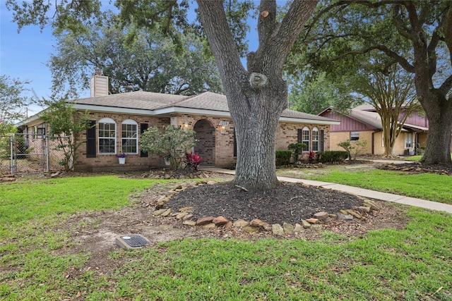 1008 N 30th St, Nederland, TX 77627 - ranch-style home featuring a chimney, brick siding, and a gate