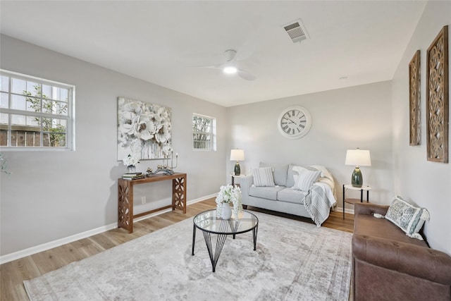 1008 N 30th St, Nederland, TX 77627 - living area featuring a ceiling fan, wood finished floors, and baseboards