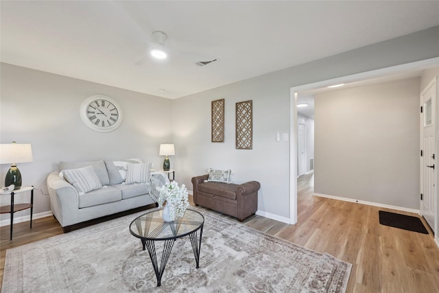 1008 N 30th St, Nederland, TX 77627 - living area with a ceiling fan, light wood-style floors, and baseboards