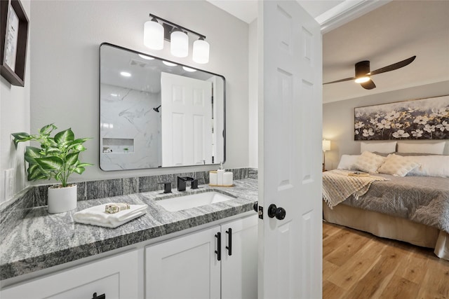 1008 N 30th St, Nederland, TX 77627 - full bathroom featuring vanity, a marble finish shower, wood finished floors, and ceiling fan