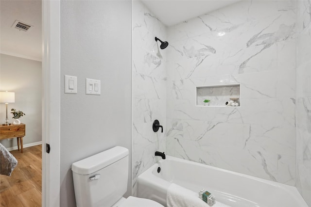 1008 N 30th St, Nederland, TX 77627 - full bathroom featuring toilet, bathing tub / shower combination, wood finished floors, and crown molding