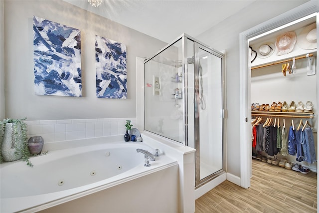 15314 Yellow Oak Trl, Cypress, TX 77433 - full bathroom with a shower stall, a tub with jets, wood finished floors, and a walk in closet