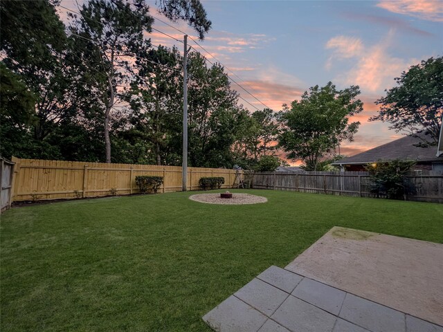 15314 Yellow Oak Trl, Cypress, TX 77433 - yard at dusk featuring a patio area
