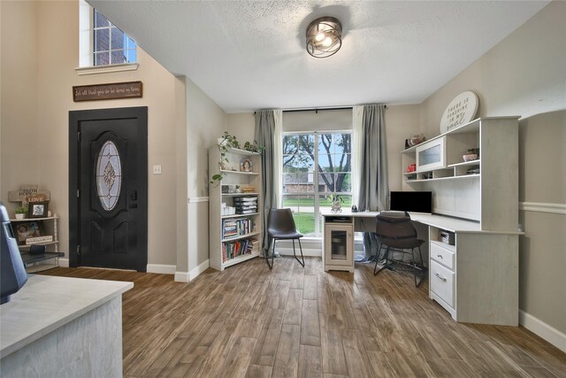 15314 Yellow Oak Trl, Cypress, TX 77433 - office area featuring wood finished floors, baseboards, and a textured ceiling
