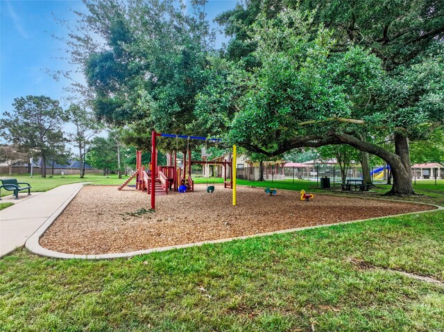 15314 Yellow Oak Trl, Cypress, TX 77433 - communal playground featuring a lawn