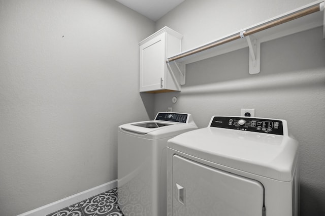 2302 Elmwood Trl, Katy, TX 77493 - laundry room with cabinet space, independent washer and dryer, and baseboards