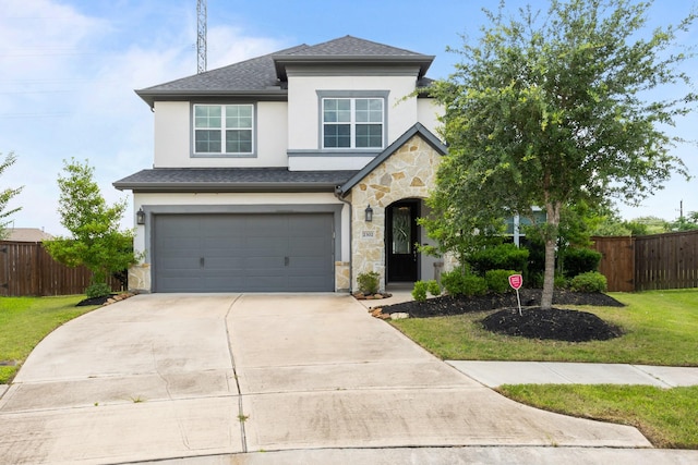 2302 Elmwood Trl, Katy, TX 77493 - view of front of house featuring stone siding, stucco siding, a garage, concrete driveway, and roof with shingles