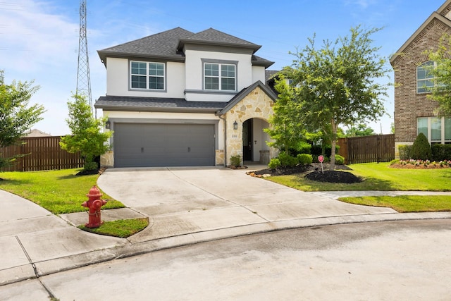 2302 Elmwood Trl, Katy, TX 77493 - traditional home with stucco siding, stone siding, concrete driveway, a garage, and roof with shingles