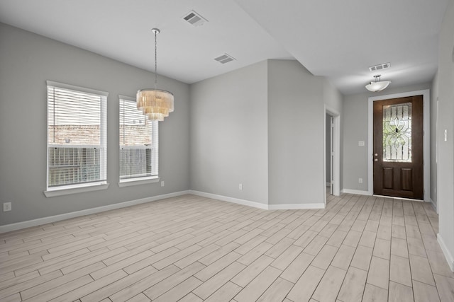 2302 Elmwood Trl, Katy, TX 77493 - entryway featuring baseboards, a chandelier, and light wood-style floors