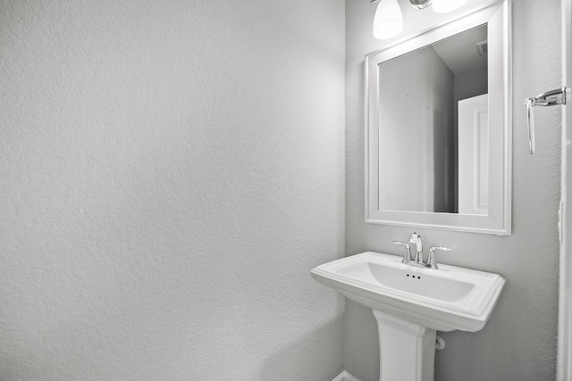 2302 Elmwood Trl, Katy, TX 77493 - bathroom with a sink and a textured wall