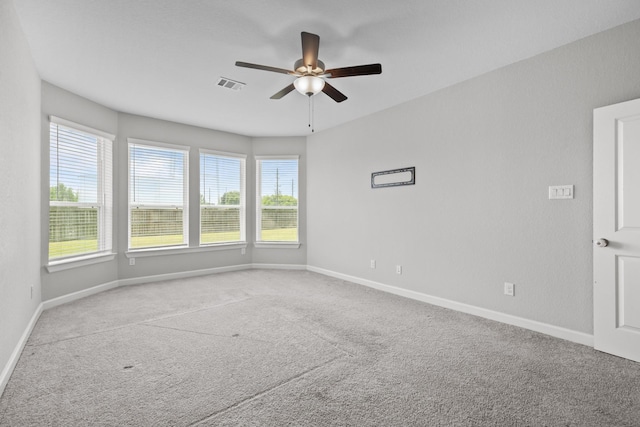 2302 Elmwood Trl, Katy, TX 77493 - empty room with carpet flooring, a ceiling fan, plenty of natural light, and baseboards