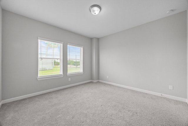 2302 Elmwood Trl, Katy, TX 77493 - unfurnished room featuring baseboards, a smoke detector, and carpet flooring
