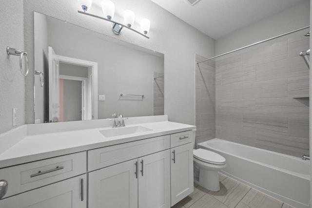 2302 Elmwood Trl, Katy, TX 77493 - bathroom featuring vanity, bathing tub / shower combination, and toilet