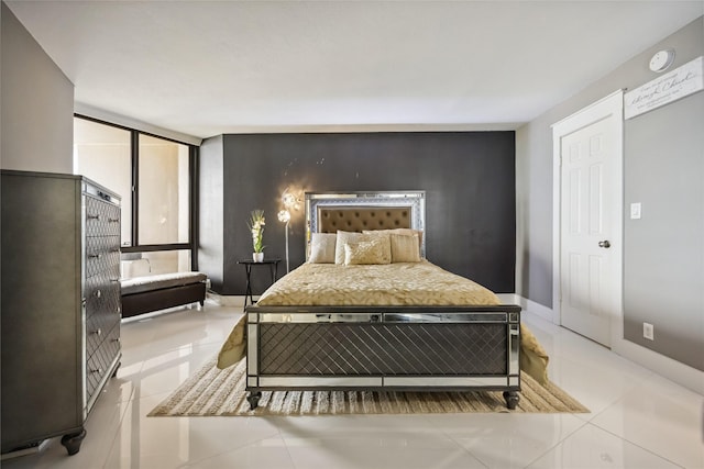 3525 Sage Rd Unit 1713, Houston, TX 77056 - tiled bedroom featuring floor to ceiling windows and baseboards