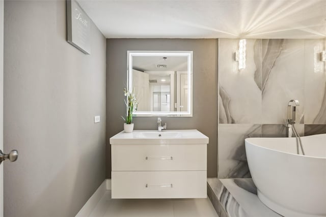3525 Sage Rd Unit 1713, Houston, TX 77056 - bathroom with vanity and a soaking tub