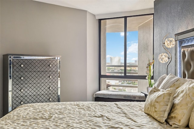 3525 Sage Rd Unit 1713, Houston, TX 77056 - bedroom with multiple windows and a wall of windows