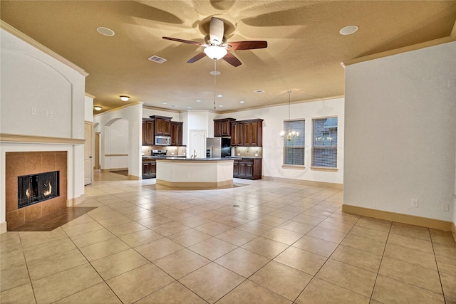 10 Tallgrass Way, Spring, TX 77389 - unfurnished living room with ceiling fan, light tile patterned flooring, a fireplace, ornamental molding, and recessed lighting