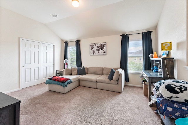 14706 Meadow Acre Trl, Houston, TX 77049 - living room featuring carpet floors, vaulted ceiling, and baseboards